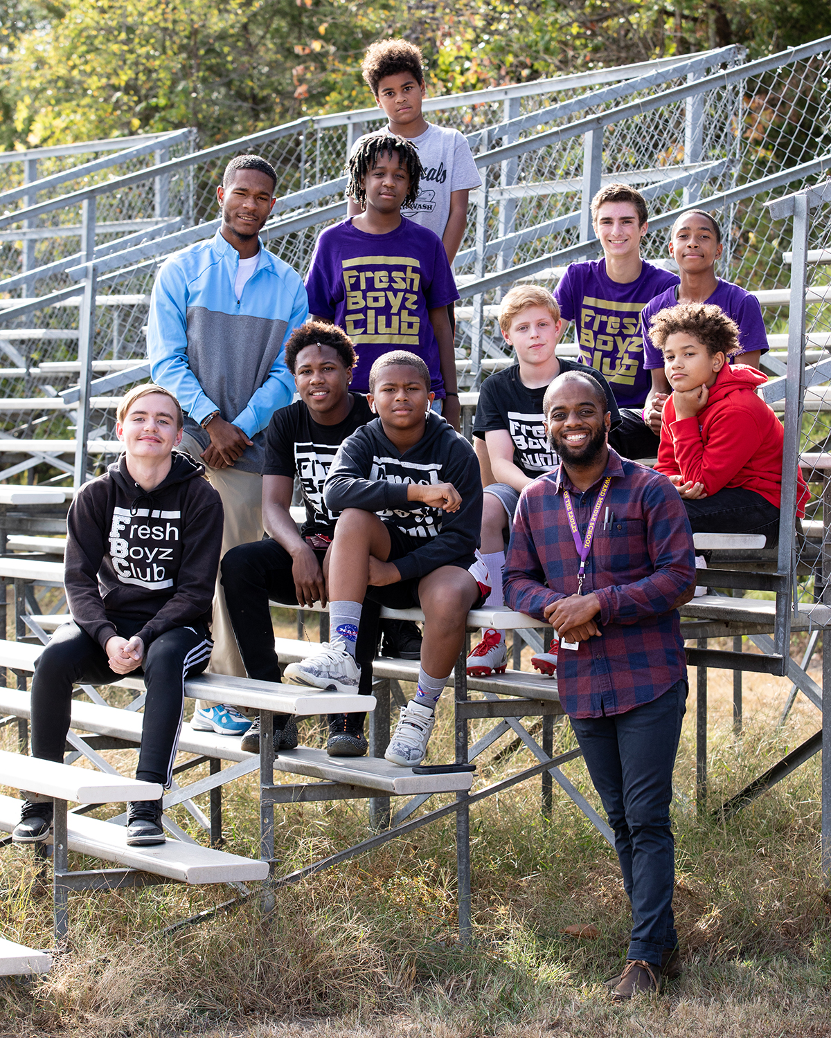 Louis Gould III ’19 (standing, far right) started the FreshBoyz Club in 2008 as a place for members to focus on helping their communities. 