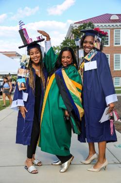 Dr. Erica Brown-Meredith with two students at Convocation