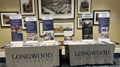 Education Immersion Day- photo fo a table of Longwood University Marketing Material for High School students