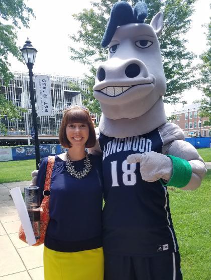 Dr. Sarah Tanner Anderson stands with Elwood (Longwood's Mascot) 
