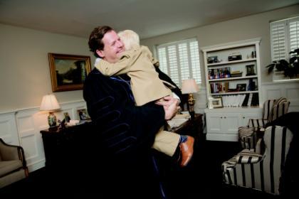 President W. Taylor Reveley IV embraces his son, Quint, following the undergraduate commencement ceremony on May 20.