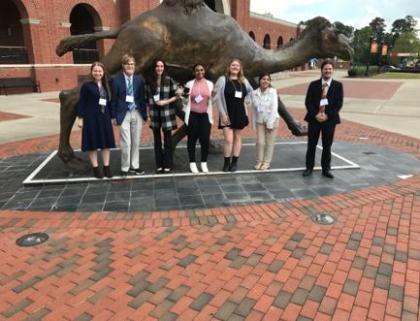Longwood students stand for a photo outside of the Carolina’s Psychology Conference at Campbell University .
