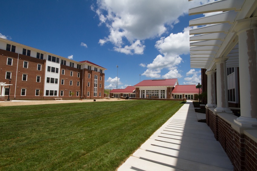 The new commons building at Lancer Park (center), flanked by the two new residence halls