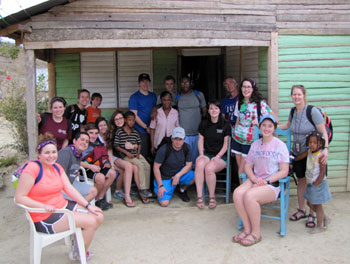 Longwood University Study Abroad group visiting at the house of a local woman in the Dominican Republic