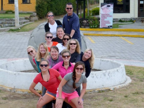 Longwood students pose by a statue in Ecuador