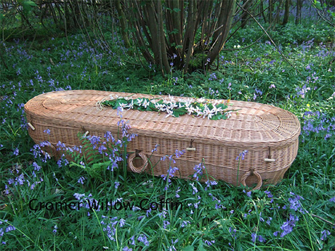Biodegradable coffins like this wicker one are an alternative way of burial favored by some conservationists. [Photo by thegreentimes.co.za]