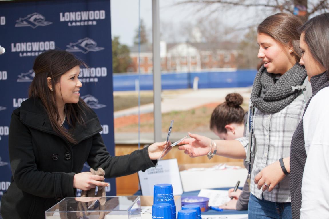 Students receive information at Love Your Longwood table