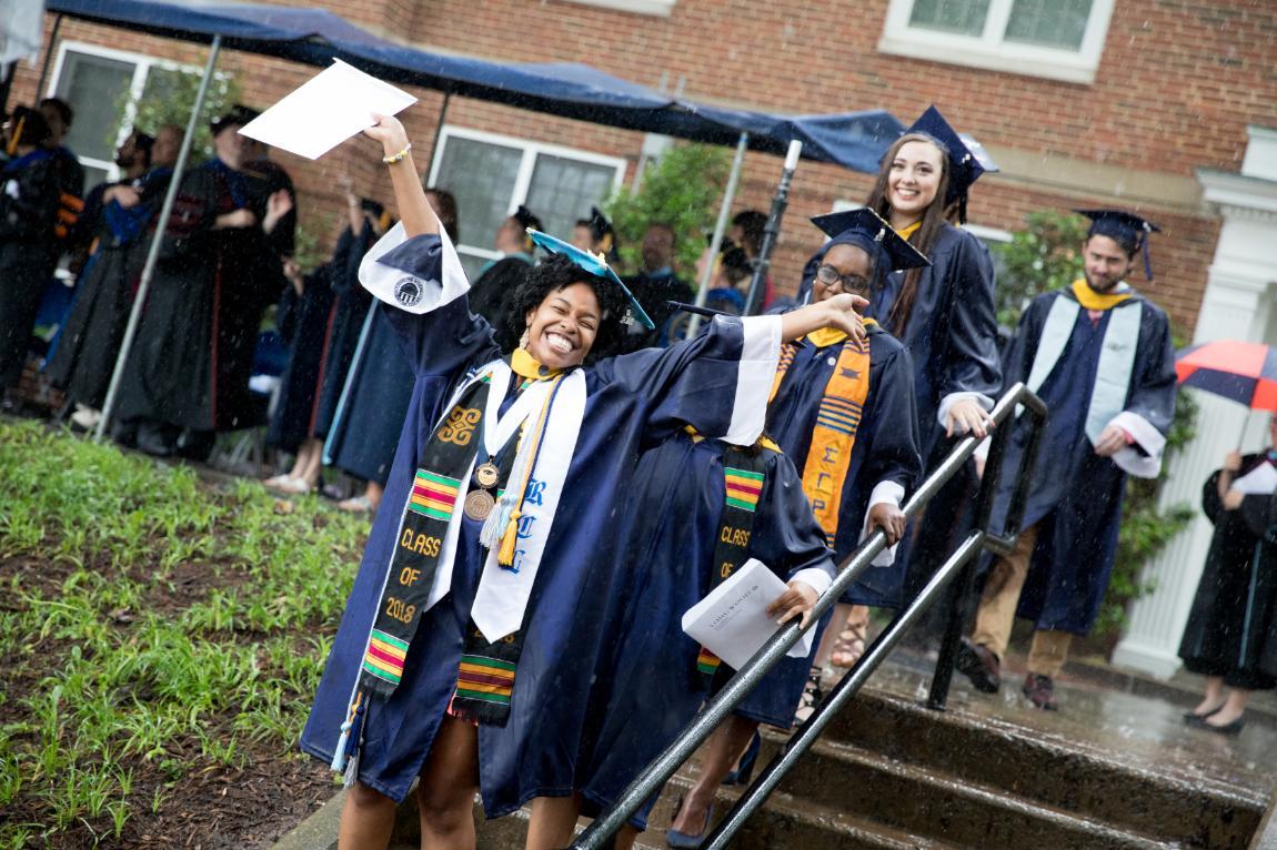Student celebrating after walking at Commencement 2018