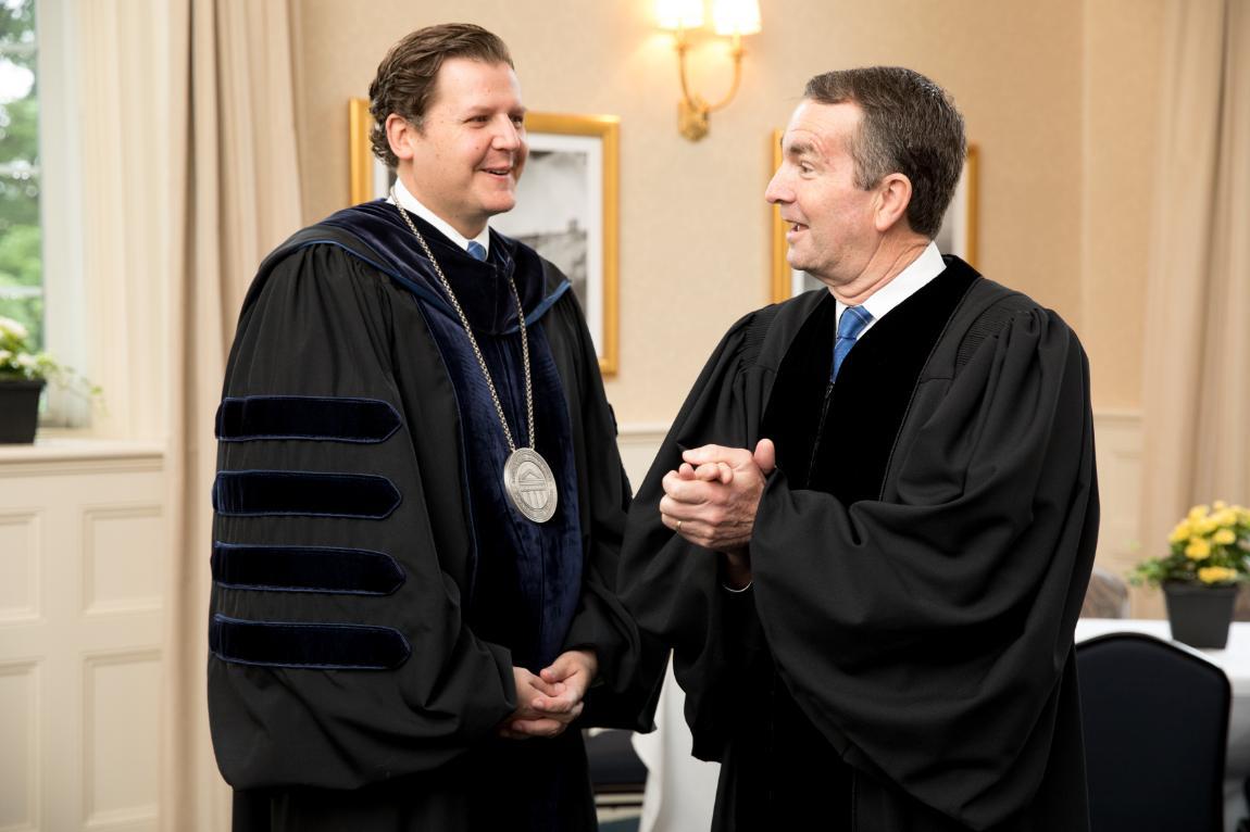 President W. Taylor Reveley IV shares a laugh with Va. Gov. Ralph S. Northam before Saturday's commencement