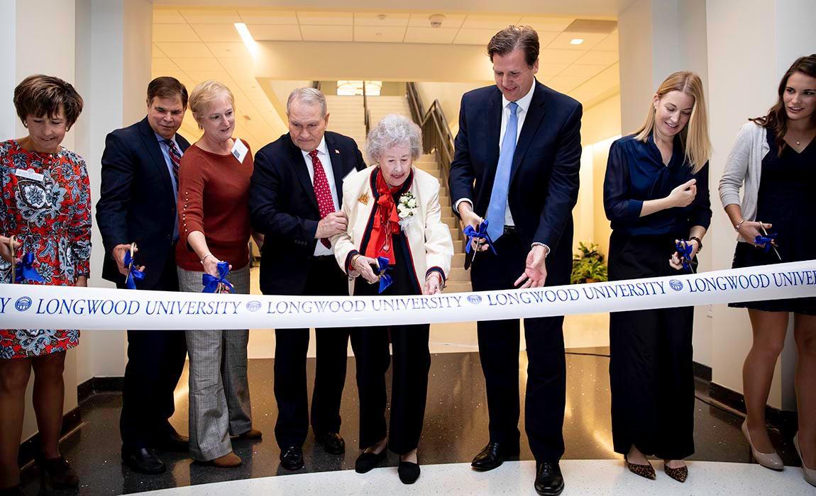 Elsie Upchurch ’43, joined by President W. Taylor Reveley, IV and other Longwood dignitaries, was on hand to cut the ribbon to officially open the new Upchurch University Center on Friday.
