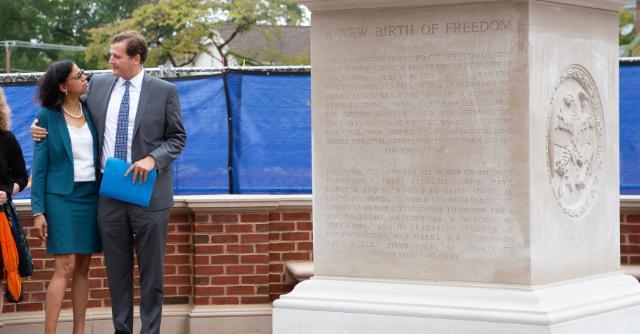 Longwood President W. Taylor Reveley and Board of Visitors member Nadine Marsh-Carter embrace at the dedication of a new monument in Farmville dedicated to the history of the area and those who fought to expand American liberty.