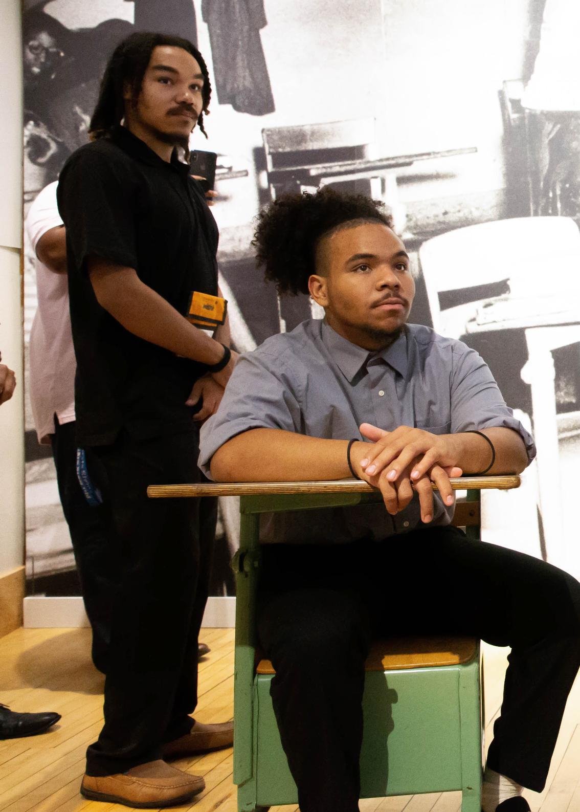 James Bennett (left) looks on as participants in the Call Me MISTER Summer Institute listen to a presentation at the Moton Museum.