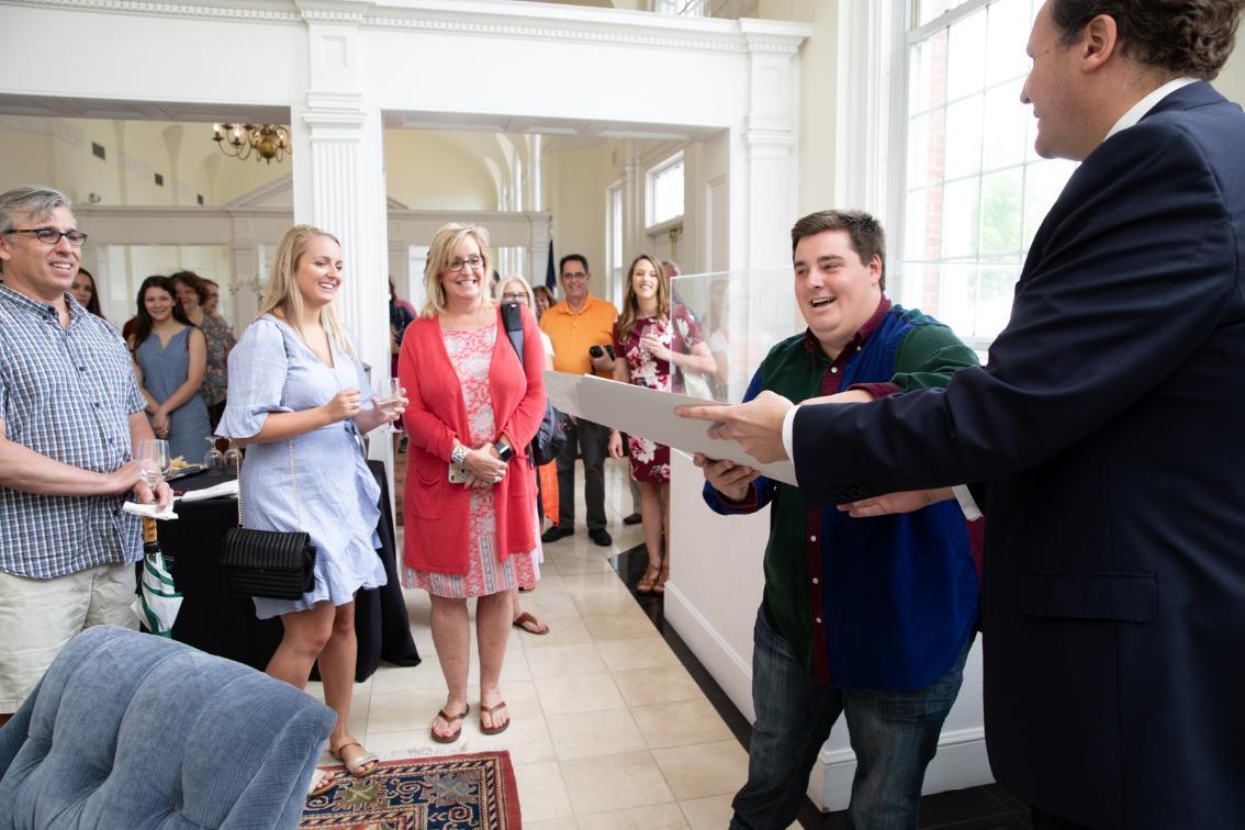 President Reveley hands the diplomas to Josh Darst