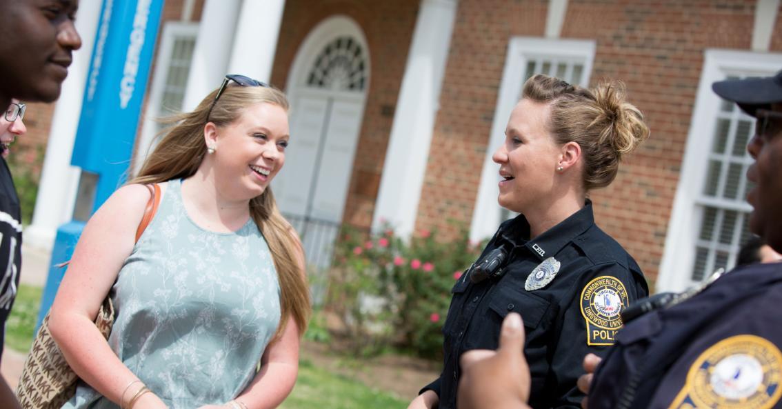 LUPD officers Rachel Whitehead and Quincy Steele chat with students on Brock Commons.