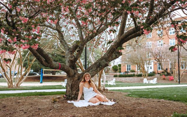 Grace Norton '22, the Longwood student who found her aunt’s tree, took senior photos under the tree just weeks before she graduated.