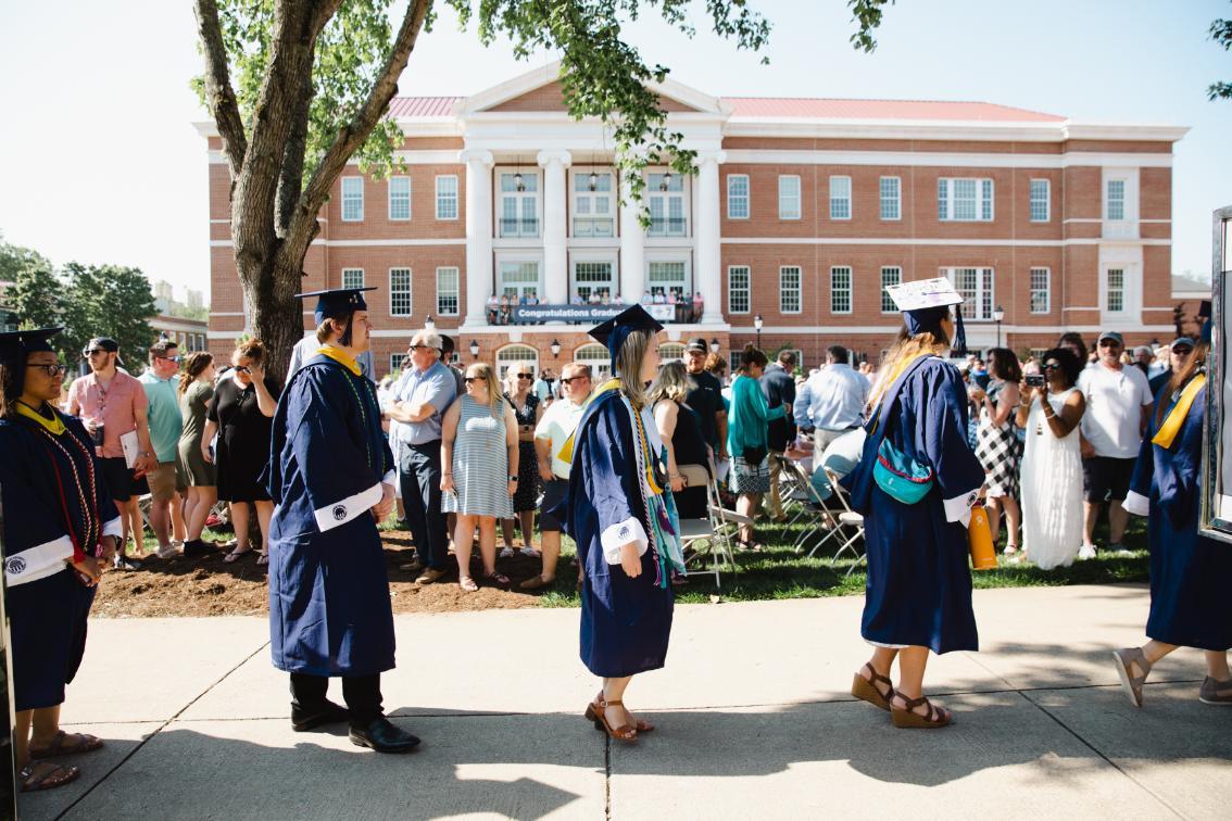 Student processional with Upchurch in the background