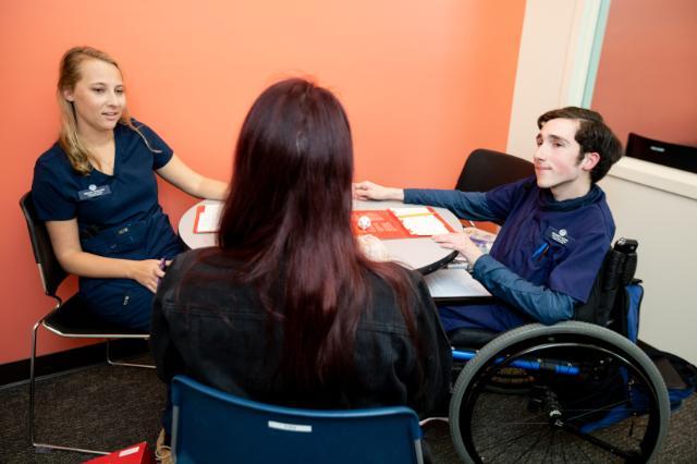 Communication sciences and disorders graduate students work with a client