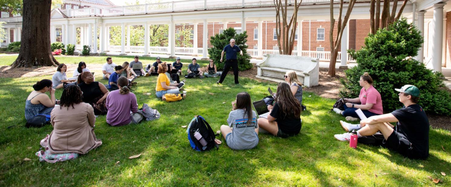 Jake Milne leading a class beside the Colonnades