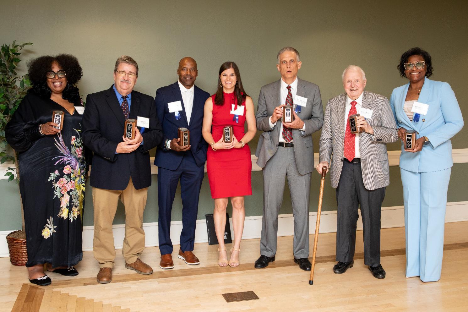 The 2026 Alumni Award recipients stand together for a group shot at the conclusion of the awards ceremony and dinner.