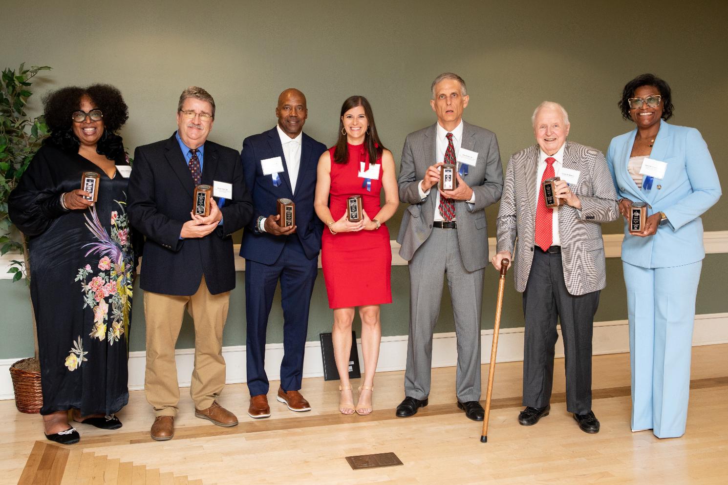 The 2026 Alumni Award recipients stand together for a group shot at the conclusion of the awards ceremony and dinner.