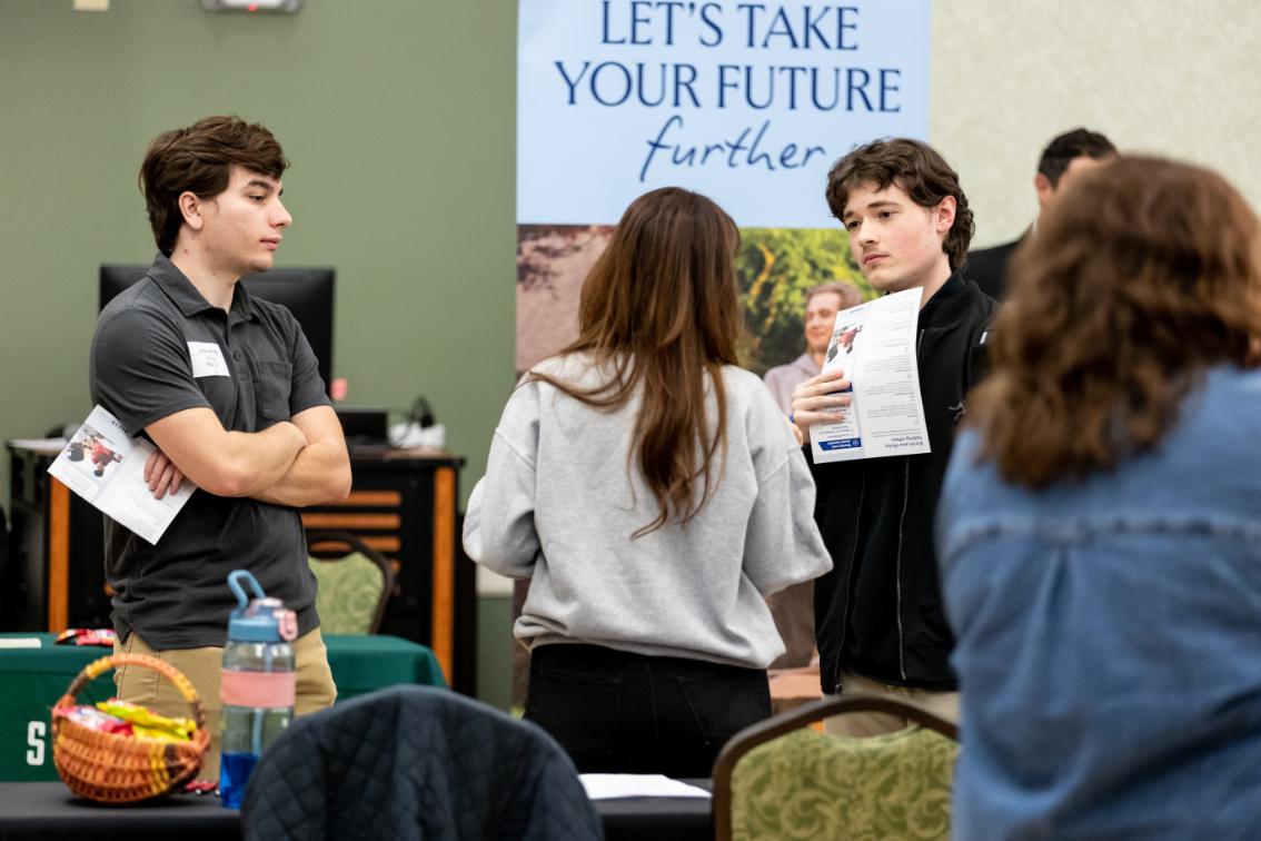 Longwood students talk with representatives at a career fair.