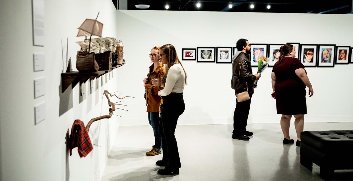 People looking at exhibits at the Longwood Center for the Visual Arts