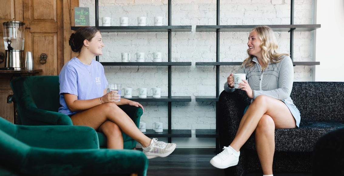 People drinking coffee at Poplar Sips in Downtown Farmville