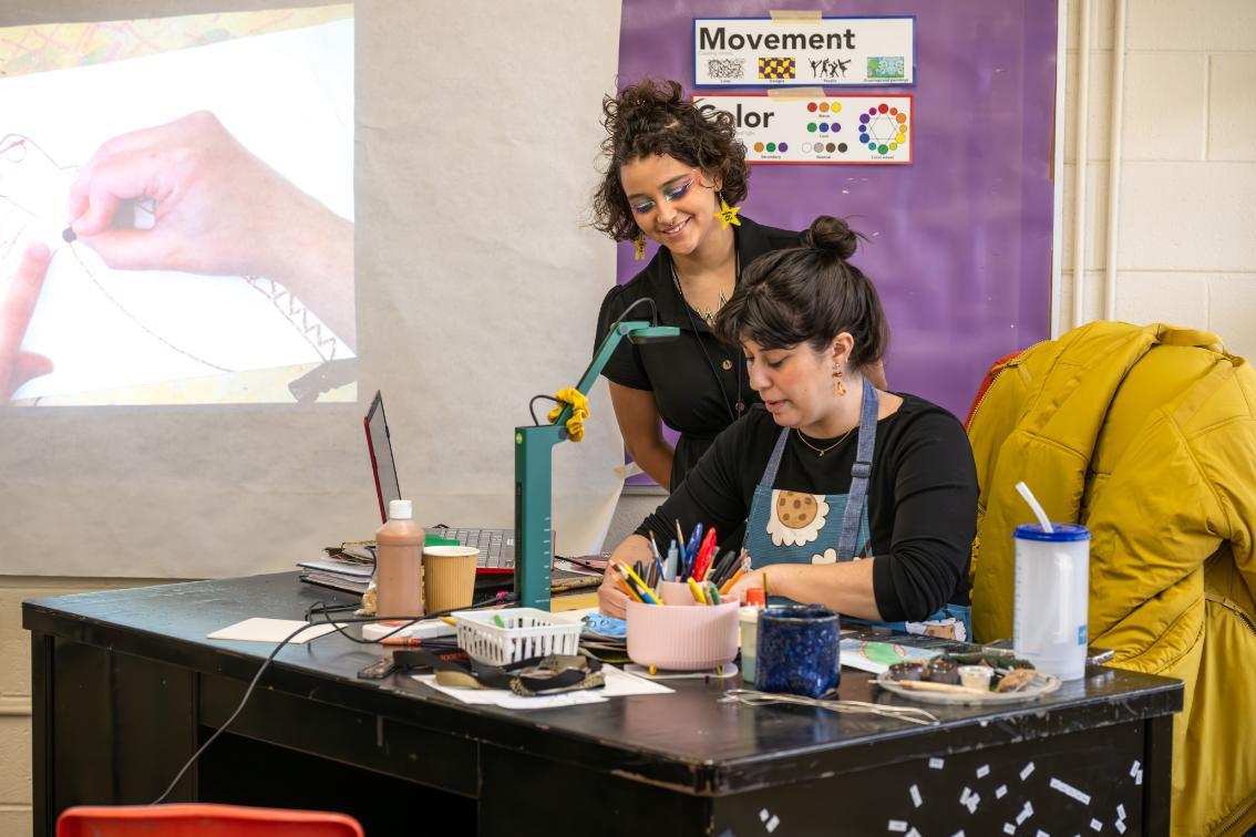 Student works with supervisor in a classroom during a work shadow