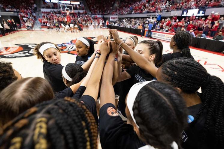 Longwood women's basketball team huddled after a game against NC State in the NCAA Tournament