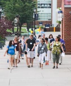 Student group walking on campus at orientation
