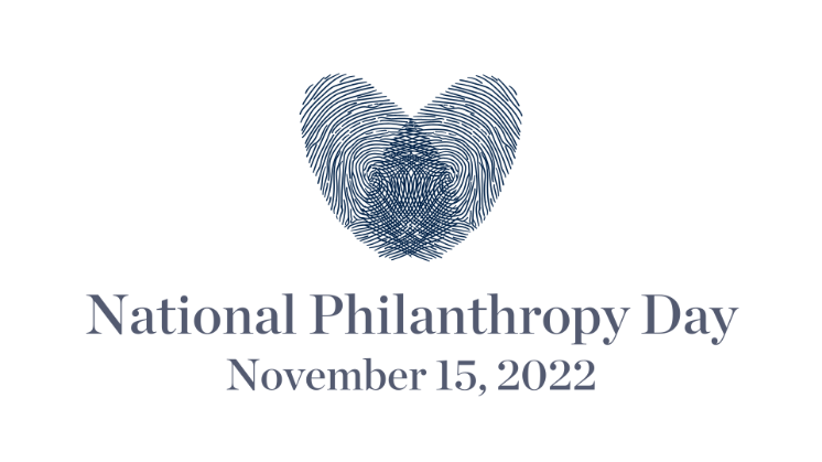 -Centered graphic featuring two overlapping navy blue fingerprints forming a heart shape above the text “National Philanthropy Day.”