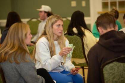Student participates in the 2025 Poverty Simulation event