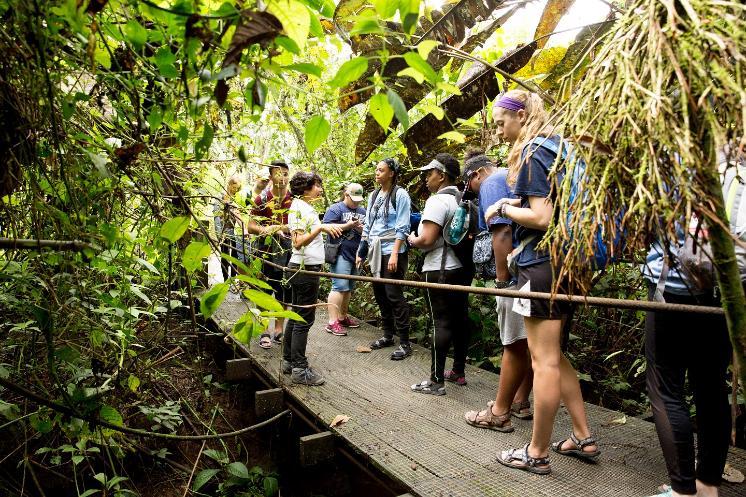 LU student group in Costa Rica on a bridge with greenery