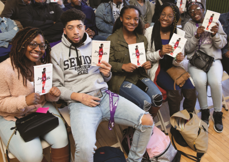 Kids holding up books