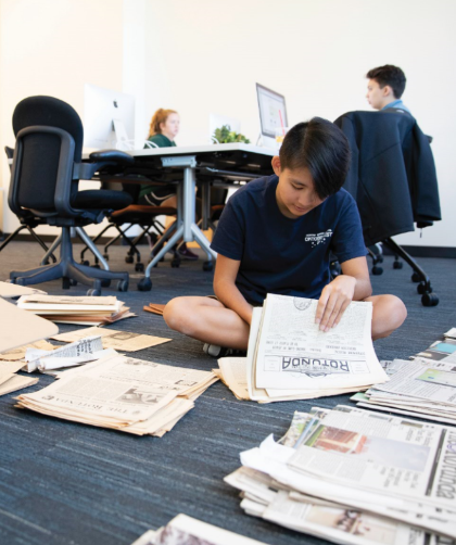 Student reading newspaper
