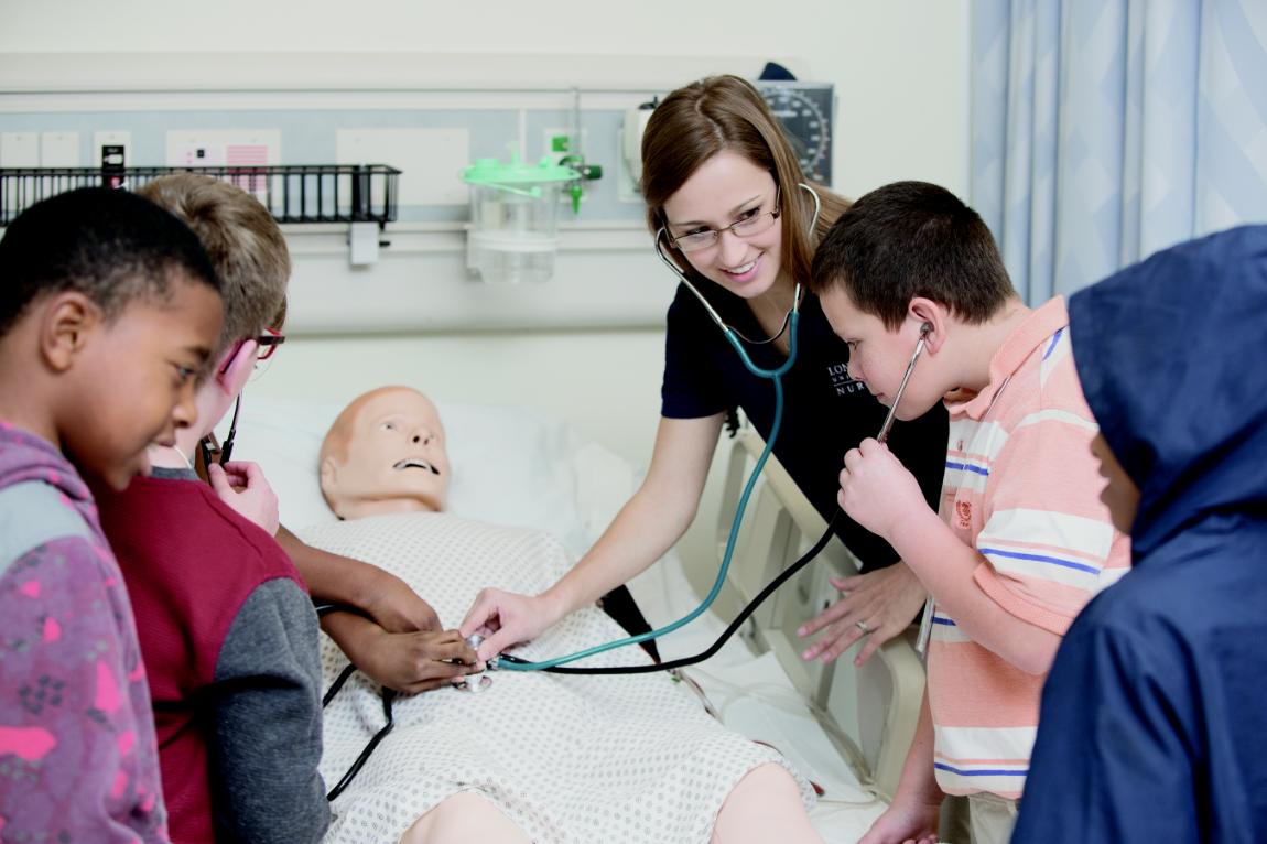 School students participating in Lancer for a Day in the Nursing lab