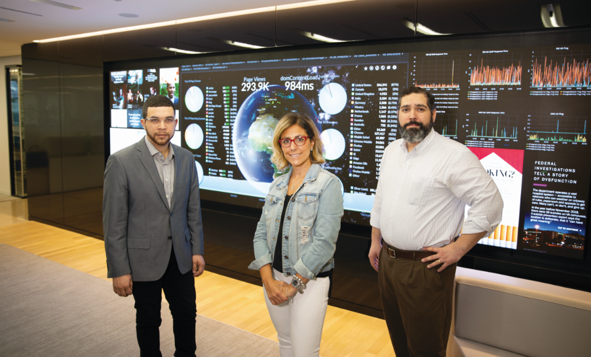 The iconic Washington Post newsroom, made famous in the 1976 film All the President’s Men, has been transformed into a modern multiplatform information hub featuring a digital media wall that tracks website and social media analytics in real time. Longwood alumni Travis Lyles (left), Anna Knapp and Anthony J. Rivera are playing a role in the news company’s resurgence.