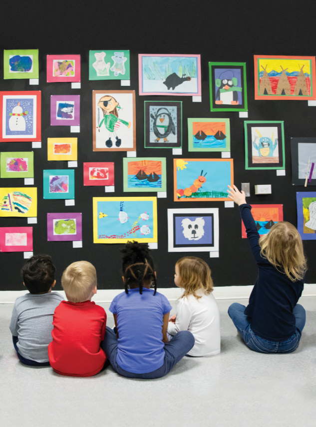 Children from Longwood’s Andy Taylor Center contemplate artwork in the Annual Area Youth Art Exhibition at the LCVA
