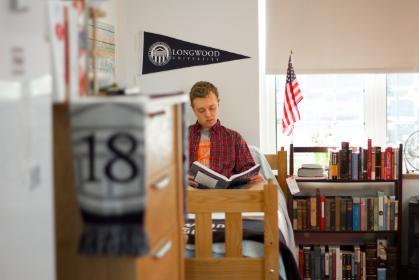 Boy reading in dormroom