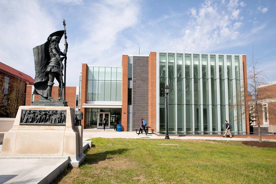 Joan of Arc stands watch as students make their way into Bedford Hall for their first class of the day. This statue&mdash;the third on campus depicting the French heroine&mdash;was created by famed Scottish sculptor Alexander Stoddart and dedicated in 2018.