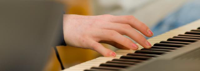 Hand on piano