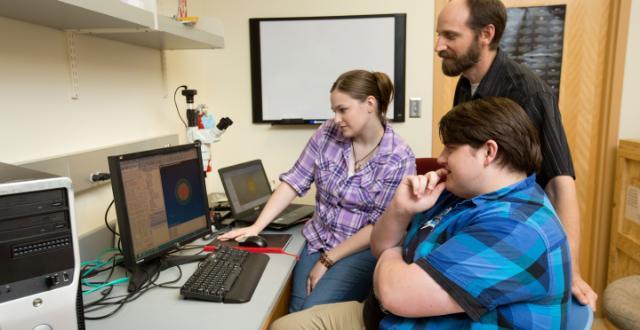 Laura Deale ’17, Bob Highley ’18 and Dr. Kenneth Peskta II examine one of Highley’s just created three-layer models of a white dwarf star, part of a research project.
