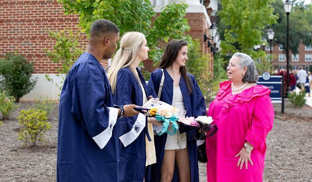 Longwood Rector Pia Trigiani talks with students prior to the Convocation ceremony in early September.