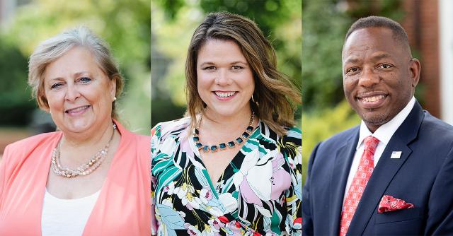New BOV members 2022 - Three professional headshots displayed side by side outdoors. A woman in a coral blazer, a woman in a floral dress, and a man in a navy suit smile at the camera. Each stands in front of blurred greenery and brick campus buildings. The portraits appear to represent university leadership or board members.