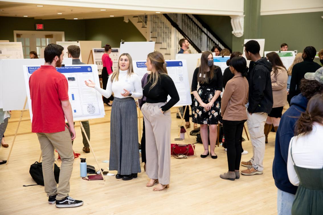 Students presenting their posters during Research Day