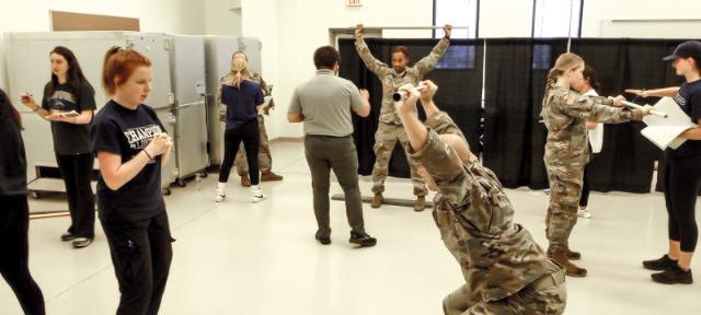 Kinesiology students screening soldiers