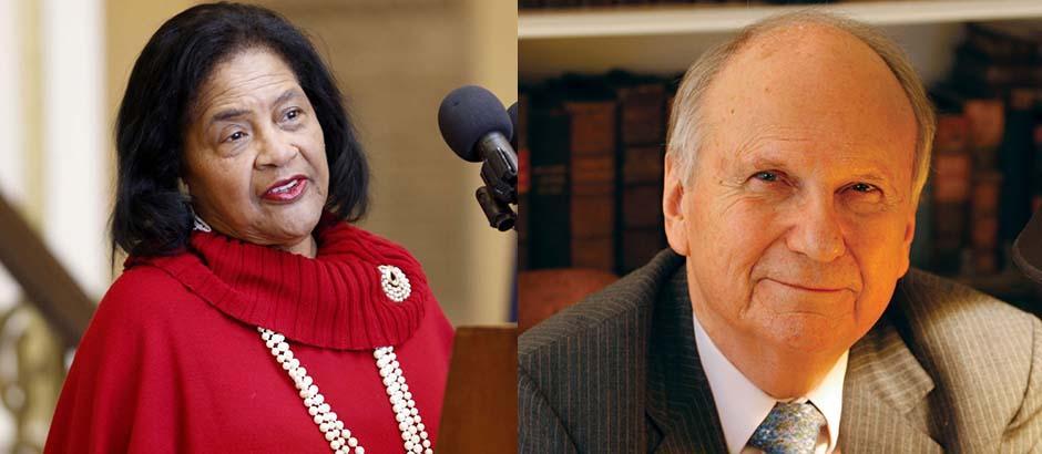 Joan Johns Cobbs and Dick Howard - Two side-by-side portraits of commencement speakers. On the left, a woman in a red sweater speaks at a podium with a microphone. On the right, an older man in a suit sits in front of shelves of books. Both are shown in warmly lit, professional settings.