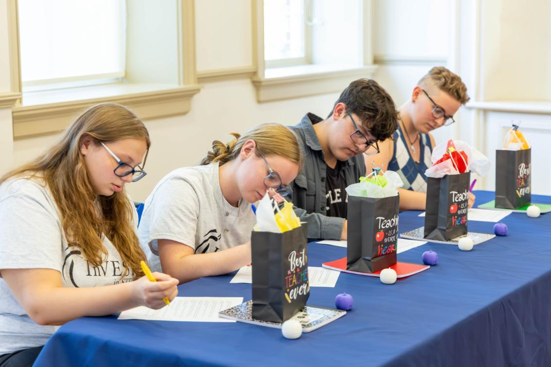 InVEST in STEM students sign their agreements during the 2025 Signing Ceremony