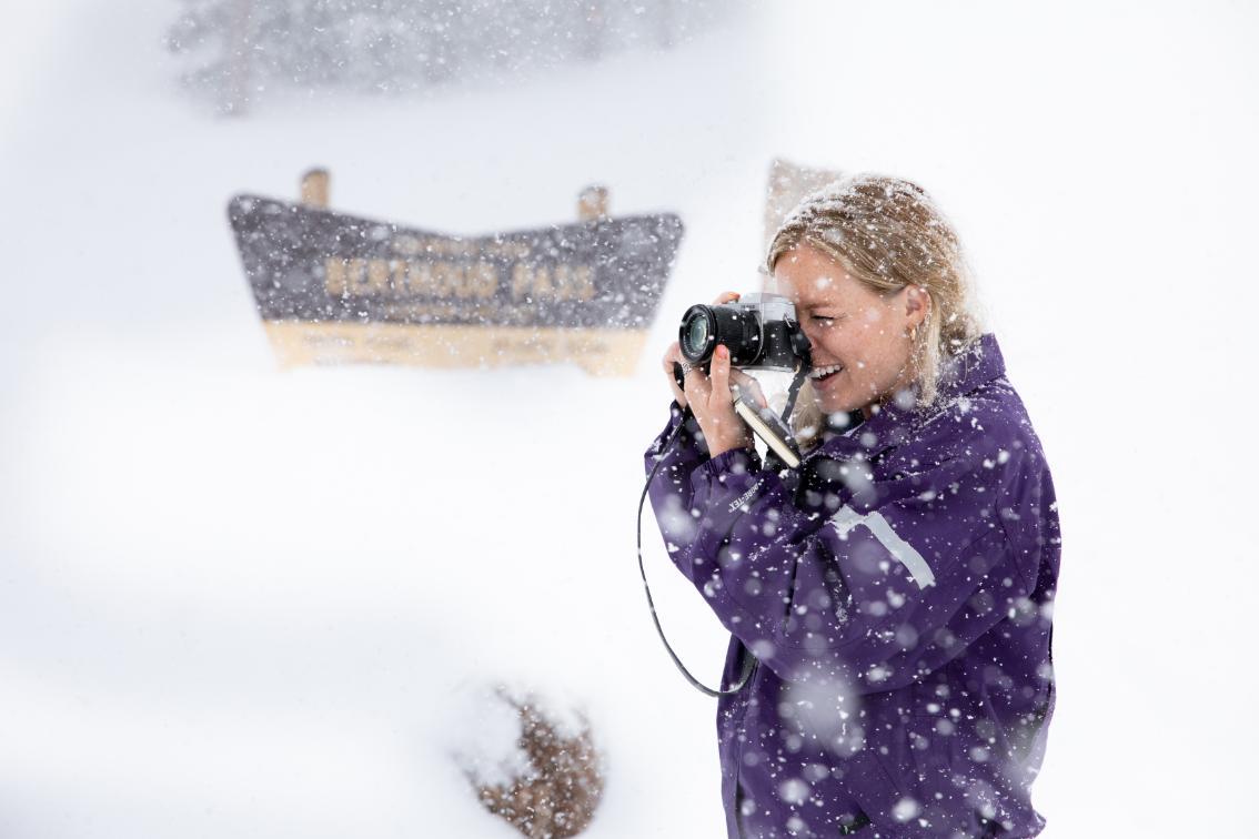 Student takes photos during fresh snowfall during Colorado Brock Experience