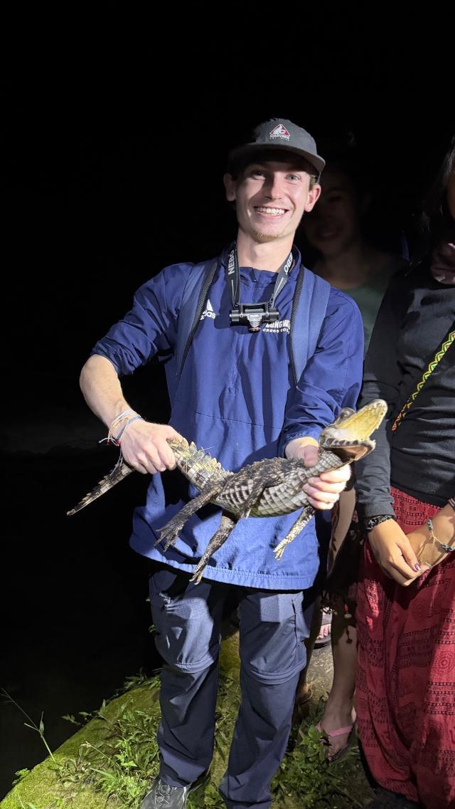 Andrew Schaefer ’26 with a caiman